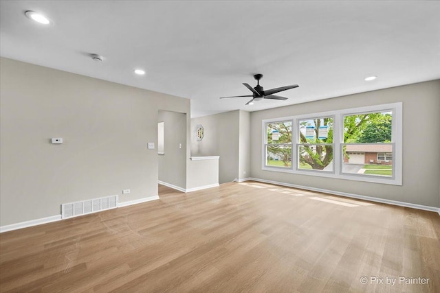 6710 Valley View Rd, Hanover Park, IL 60133 - unfurnished living room with light wood finished floors, ceiling fan, and recessed lighting