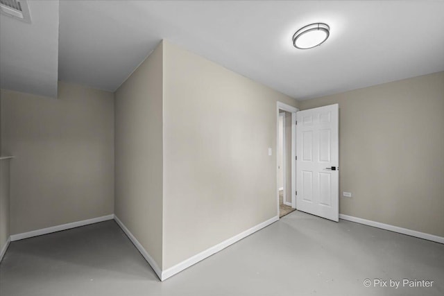 6710 Valley View Rd, Hanover Park, IL 60133 - additional living space featuring baseboards and concrete flooring