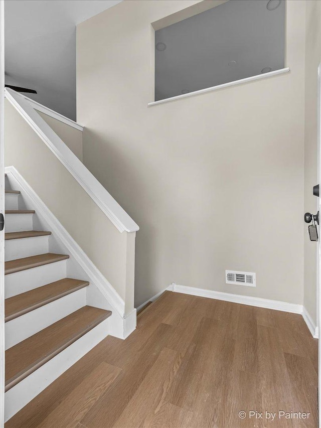 6710 Valley View Rd, Hanover Park, IL 60133 - stairway with wood finished floors and baseboards