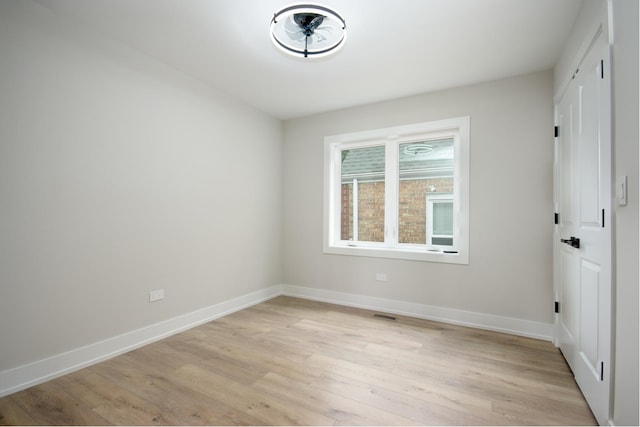 8402 S Carpenter St, Chicago, IL 60620 - unfurnished room with light wood-style floors and baseboards