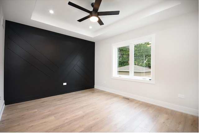 8402 S Carpenter St, Chicago, IL 60620 - unfurnished room featuring a tray ceiling, ceiling fan, light wood-style flooring, and recessed lighting