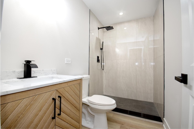 8402 S Carpenter St, Chicago, IL 60620 - full bath with a tile shower, vanity, wood finished floors, and recessed lighting