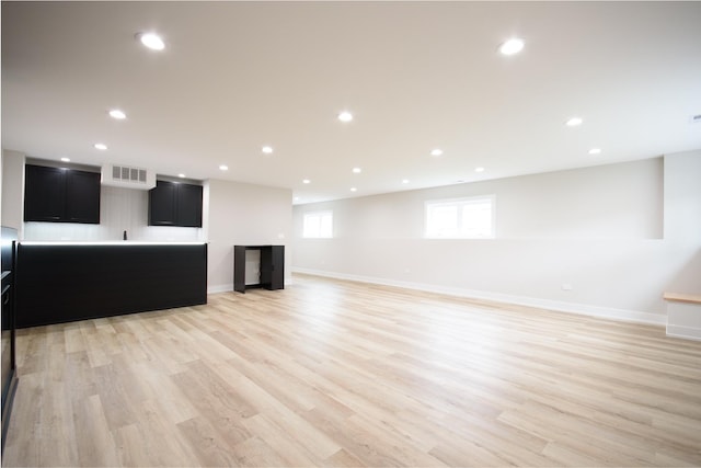 8402 S Carpenter St, Chicago, IL 60620 - unfurnished living room with light wood-type flooring and recessed lighting