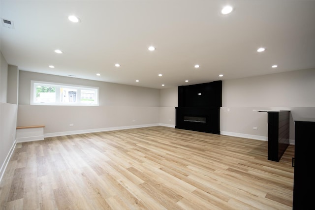 8402 S Carpenter St, Chicago, IL 60620 - unfurnished living room featuring light wood-style flooring, a large fireplace, and recessed lighting