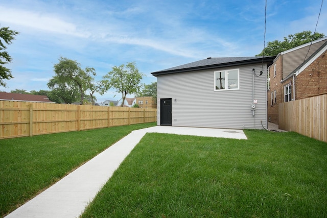 8402 S Carpenter St, Chicago, IL 60620 - rear view of house with a fenced backyard and a patio area