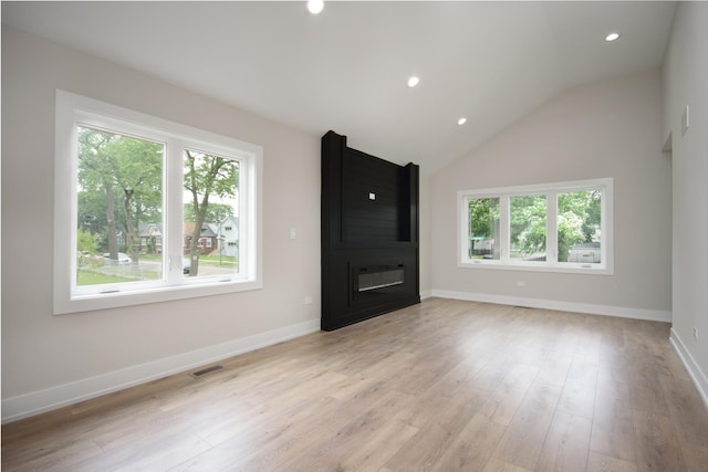 8402 S Carpenter St, Chicago, IL 60620 - unfurnished living room with a fireplace, light wood-style flooring, recessed lighting, and lofted ceiling