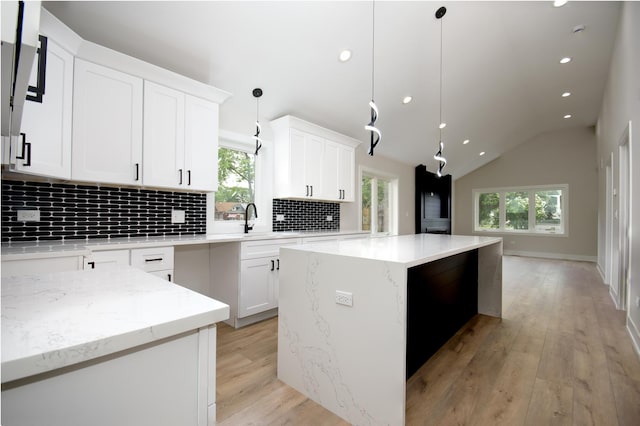 8402 S Carpenter St, Chicago, IL 60620 - kitchen featuring backsplash, healthy amount of natural light, recessed lighting, a center island, and vaulted ceiling
