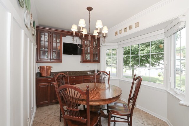 110 Tudor Dr, Barrington, IL 60010 - dining space featuring light tile patterned floors, a chandelier, and plenty of natural light