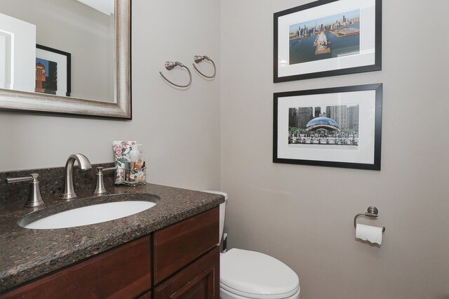 110 Tudor Dr, Barrington, IL 60010 - half bathroom featuring vanity and toilet