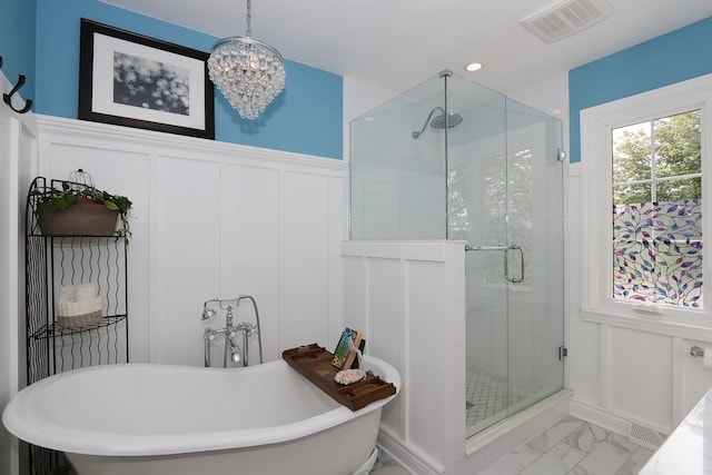 110 Tudor Dr, Barrington, IL 60010 - bathroom featuring a decorative wall, marble finish flooring, a stall shower, a freestanding tub, and a wainscoted wall