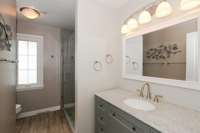110 Tudor Dr, Barrington, IL 60010 - bathroom with vanity, a shower stall, and wood finished floors