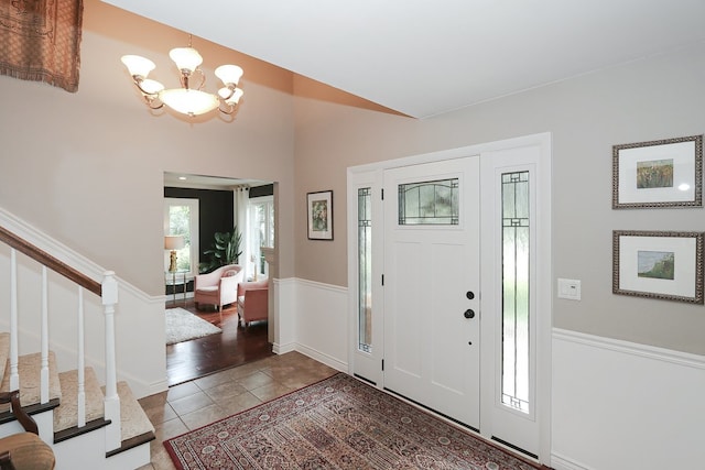 110 Tudor Dr, Barrington, IL 60010 - tiled foyer featuring a chandelier and stairway