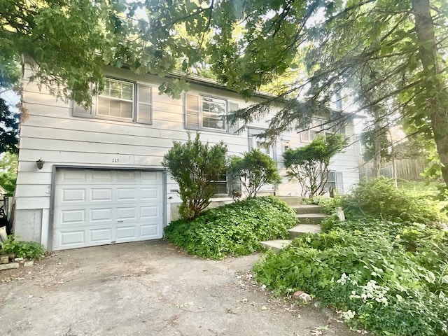 115 Walnut Dr, Streamwood, IL 60107 - view of front of home with an attached garage and concrete driveway