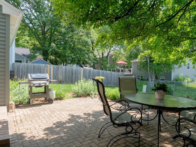 1903 Ronzheimer Ave, Saint Charles, IL 60174 - fenced backyard featuring a grill, a patio, and outdoor dining space