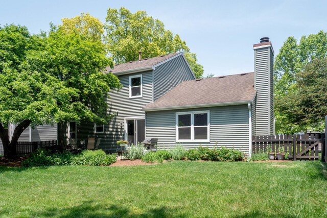 1903 Ronzheimer Ave, Saint Charles, IL 60174 - rear view of house featuring a chimney and a shingled roof