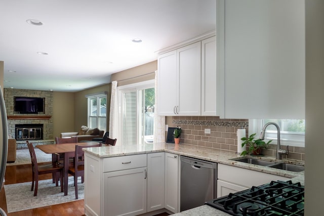 1903 Ronzheimer Ave, Saint Charles, IL 60174 - kitchen featuring dishwasher, wood finished floors, a peninsula, light stone countertops, and recessed lighting
