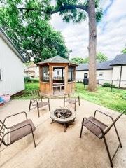 221 E Main St, Genoa, IL 60135 - view of patio with a gazebo and an outdoor fire pit