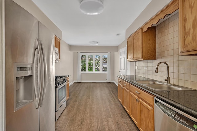 2314 Hasting Dr, Plainfield, IL 60586 - kitchen with stainless steel appliances, dark countertops, dark wood-type flooring, tasteful backsplash, and brown cabinets
