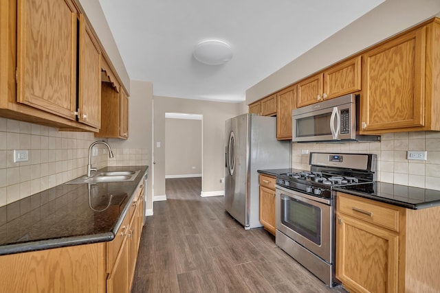 2314 Hasting Dr, Plainfield, IL 60586 - kitchen with stainless steel appliances, decorative backsplash, dark wood-style flooring, and dark stone counters