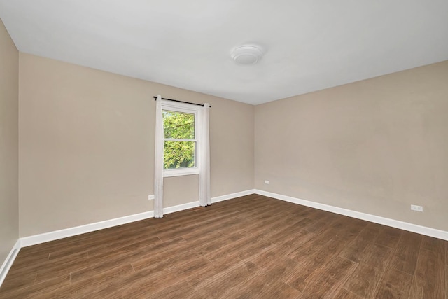 2314 Hasting Dr, Plainfield, IL 60586 - unfurnished room with baseboards and dark wood-type flooring