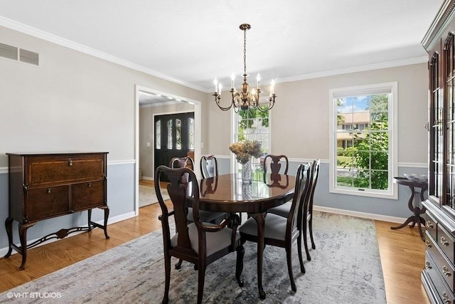 2325 Fairfax Rd, Saint Charles, IL 60174 - dining area featuring a chandelier, light wood-style flooring, and ornamental molding
