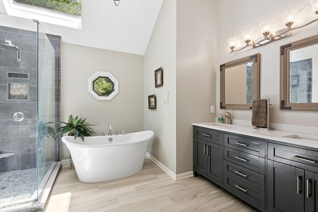 2325 Fairfax Rd, Saint Charles, IL 60174 - bathroom with a stall shower, double vanity, a freestanding tub, high vaulted ceiling, and wood finished floors