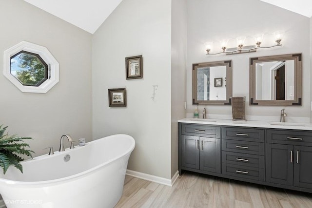 2325 Fairfax Rd, Saint Charles, IL 60174 - bathroom featuring vaulted ceiling, double vanity, and a soaking tub