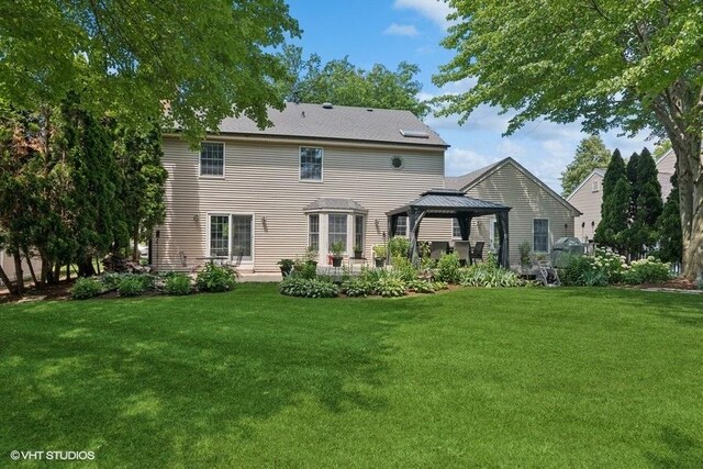 2325 Fairfax Rd, Saint Charles, IL 60174 - rear view of house featuring a gazebo, a lawn, and a patio area