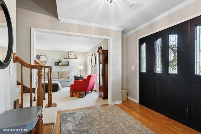 2325 Fairfax Rd, Saint Charles, IL 60174 - foyer featuring wood finished floors, ornamental molding, and stairs