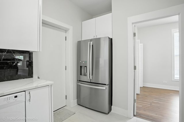 3425 W Carroll Ave, Chicago, IL 60624 - kitchen featuring stainless steel fridge, white dishwasher, white cabinets, and light stone countertops