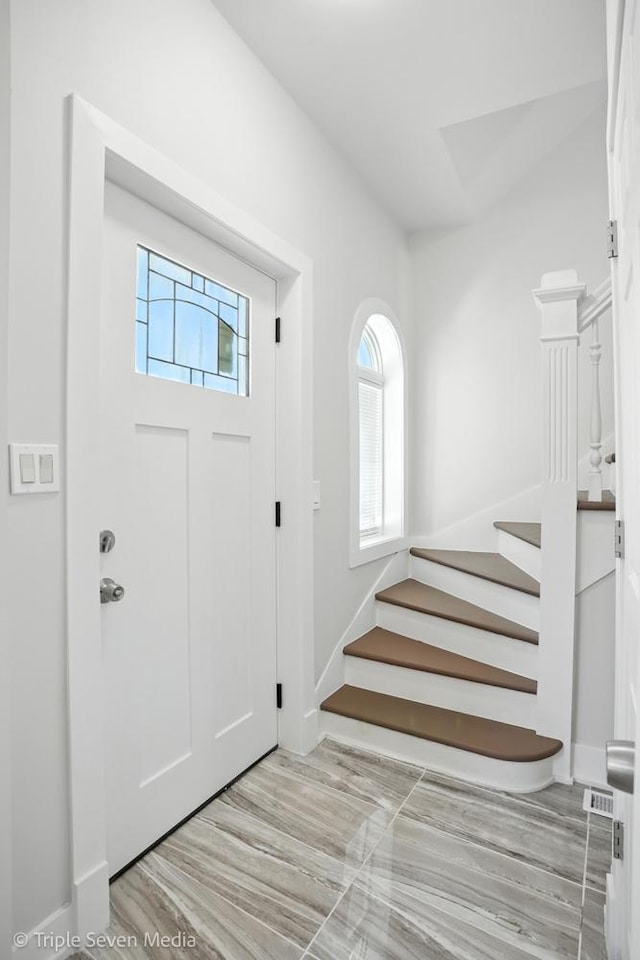 3425 W Carroll Ave, Chicago, IL 60624 - foyer entrance with stairs and baseboards