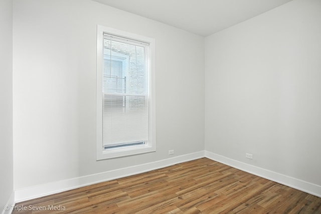 3425 W Carroll Ave, Chicago, IL 60624 - empty room featuring baseboards and wood finished floors
