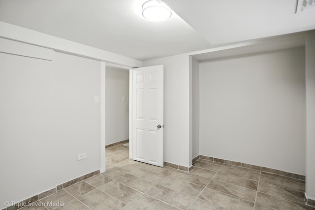 3425 W Carroll Ave, Chicago, IL 60624 - empty room featuring baseboards and light tile patterned floors