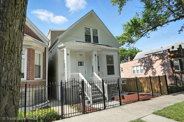 3425 W Carroll Ave, Chicago, IL 60624 - view of front of property with a fenced front yard and brick siding
