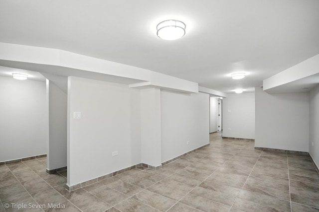 3425 W Carroll Ave, Chicago, IL 60624 - finished basement featuring light tile patterned flooring and baseboards