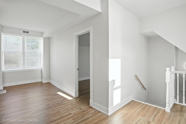 3425 W Carroll Ave, Chicago, IL 60624 - spare room featuring light wood-style flooring and baseboards