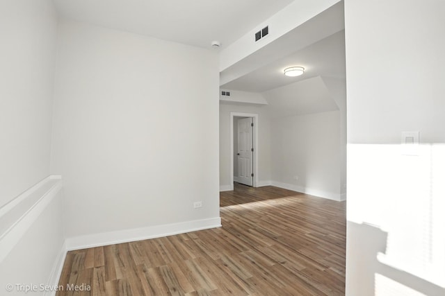 3425 W Carroll Ave, Chicago, IL 60624 - empty room with wood finished floors and a smoke detector