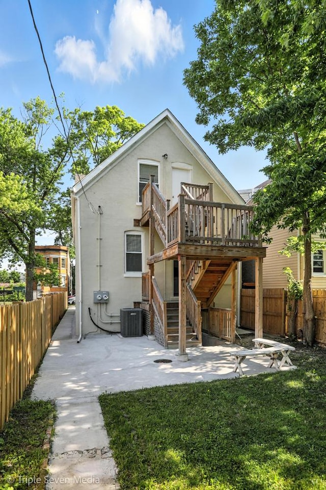3425 W Carroll Ave, Chicago, IL 60624 - rear view of property featuring a patio area, a fenced backyard, a deck, and stairs
