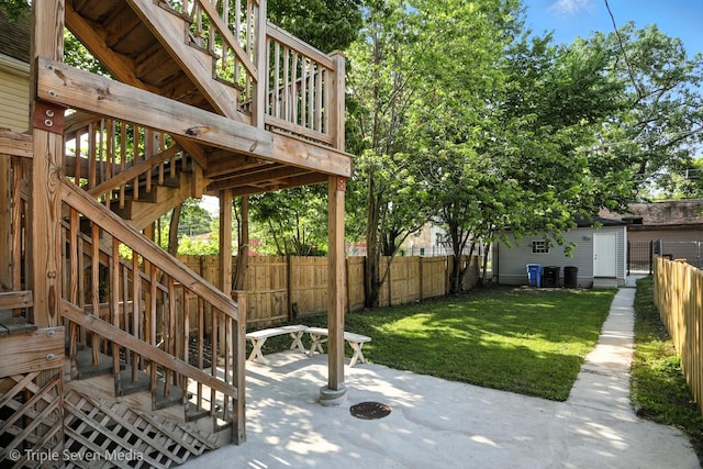 3425 W Carroll Ave, Chicago, IL 60624 - fenced backyard with stairway, a patio area, and a storage unit