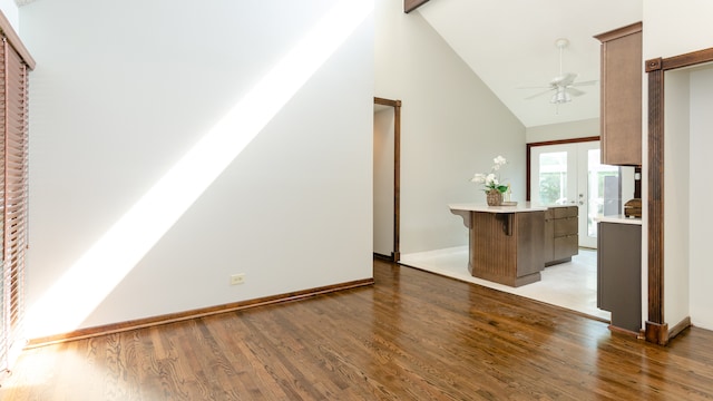 908 Claremont Dr, Downers Grove, IL 60516 - unfurnished living room with ceiling fan, wood finished floors, high vaulted ceiling, and beam ceiling