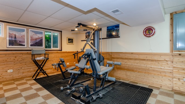 908 Claremont Dr, Downers Grove, IL 60516 - exercise room with tile patterned floors, wood walls, a wainscoted wall, and a drop ceiling