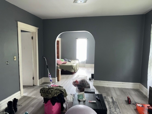 670 S Martin Luther King Jr Ave, Waukegan, IL 60085 - bedroom with arched walkways and wood finished floors