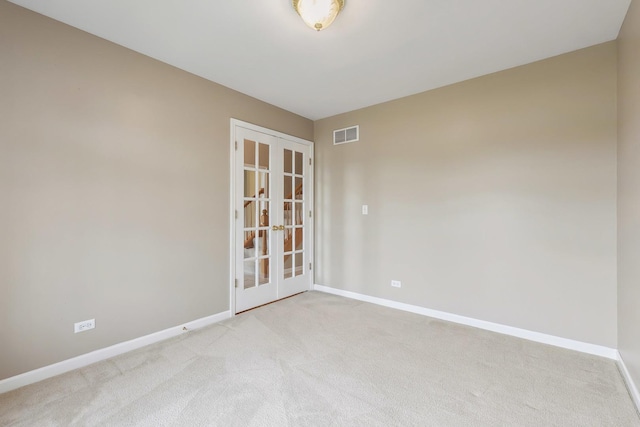 200 Saint Andrews Dr, Dekalb, IL 60115 - empty room with french doors and light colored carpet