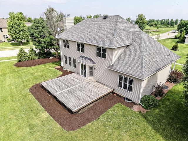 200 Saint Andrews Dr, Dekalb, IL 60115 - back of house featuring a chimney, a lawn, a shingled roof, and a wooden deck