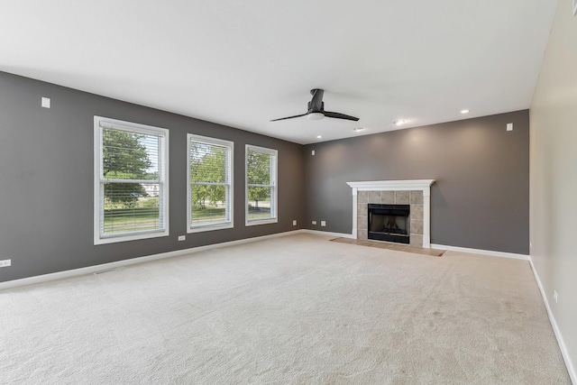 200 Saint Andrews Dr, Dekalb, IL 60115 - unfurnished living room with ceiling fan, a tile fireplace, carpet, and recessed lighting