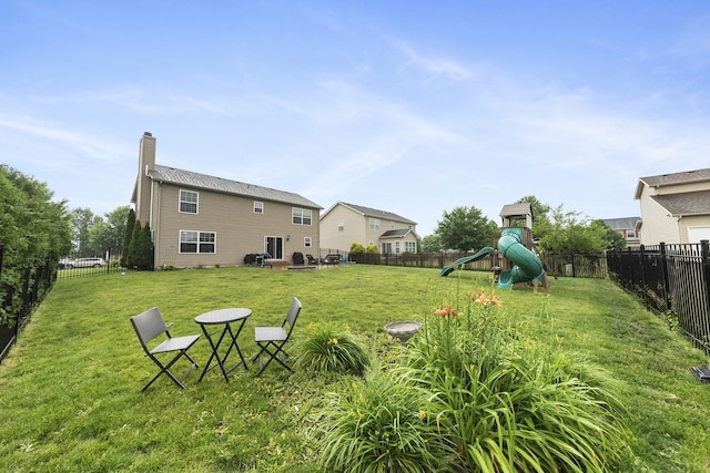 741 Oakwood St, Minooka, IL 60447 - fenced backyard featuring a playground
