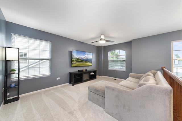 741 Oakwood St, Minooka, IL 60447 - living room with light colored carpet and a ceiling fan