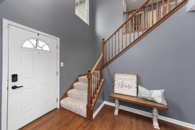 741 Oakwood St, Minooka, IL 60447 - foyer entrance with stairs, a high ceiling, and wood finished floors
