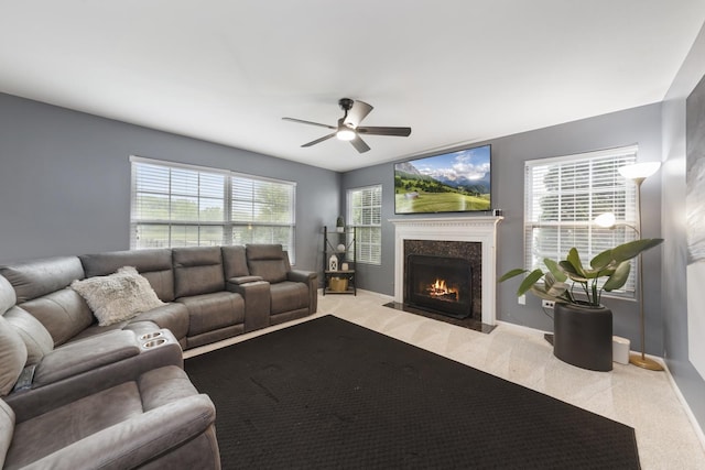 741 Oakwood St, Minooka, IL 60447 - living room featuring light carpet, a ceiling fan, a fireplace, and plenty of natural light