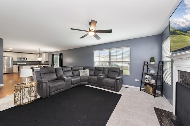 741 Oakwood St, Minooka, IL 60447 - living area with a ceiling fan and carpet floors